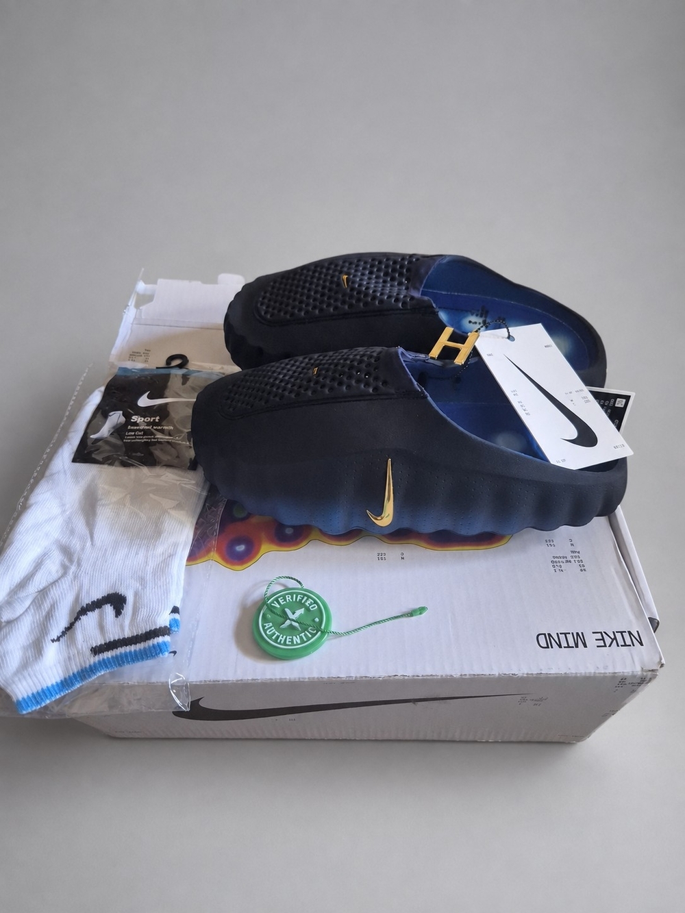 Nike Men’s Navy Foam Slip-On Sandals with Gold Swoosh